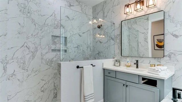 a bathroom with a sink a vanity and a mirror