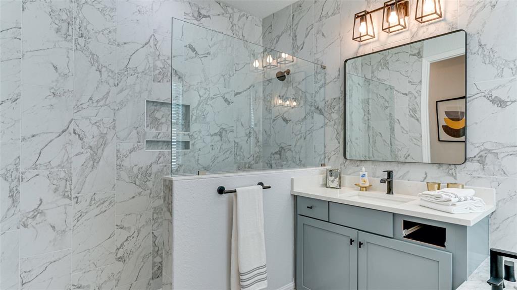 5725 Cheech Glen Lakewood Ranch, FL 34211 - Photo 13 of 63 a bathroom with a sink vanity and a mirror
