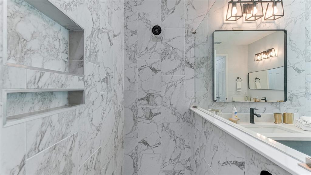 5725 Cheech Glen Lakewood Ranch, FL 34211 - Photo 15 of 63 a bathroom with a sink a vanity and a mirror