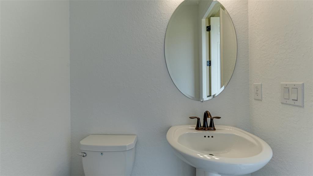 5725 Cheech Glen Lakewood Ranch, FL 34211 - Photo 21 of 63 a bathroom with a sink and a mirror