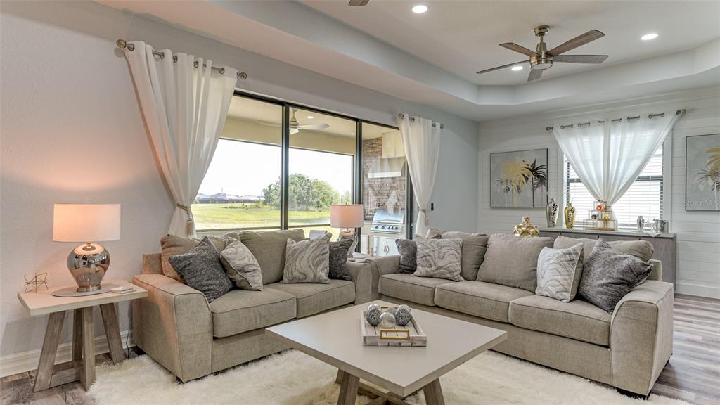 5725 Cheech Glen Lakewood Ranch, FL 34211 - Photo 22 of 63 a living room with furniture and a large window