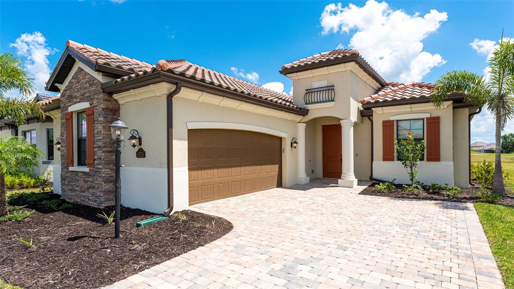 5725 Cheech Glen Lakewood Ranch, FL 34211 - Photo 28 of 63 a front view of a house with a yard