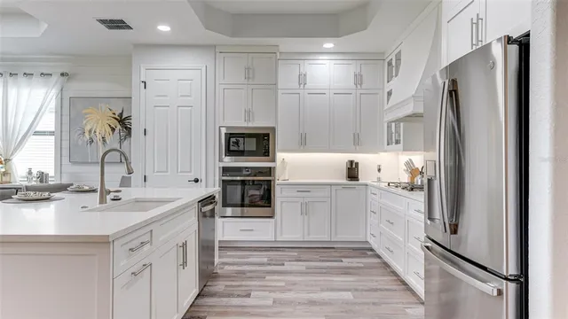 a kitchen with a stove and cabinets