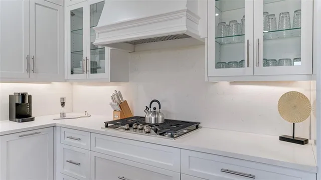a view of a hallway with wooden floor and stairs