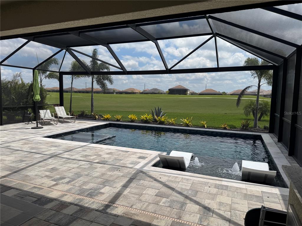 5725 Cheech Glen Lakewood Ranch, FL 34211 - Photo 53 of 63 a view of swimming pool with a lounge chair