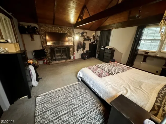 a bedroom with a bed and a mirror