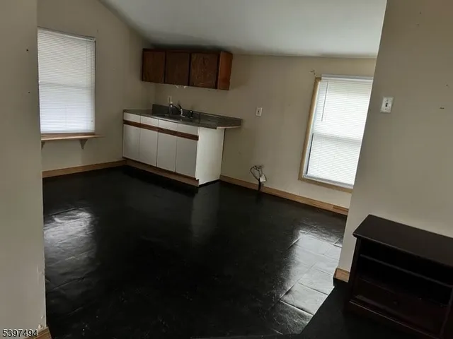 a room with hard wood floors and a window