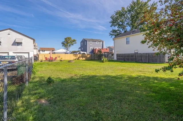 a view of a house with a yard and swimming pool