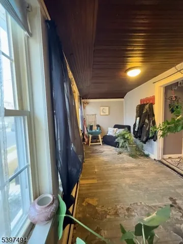 a view of an entryway with wooden floor