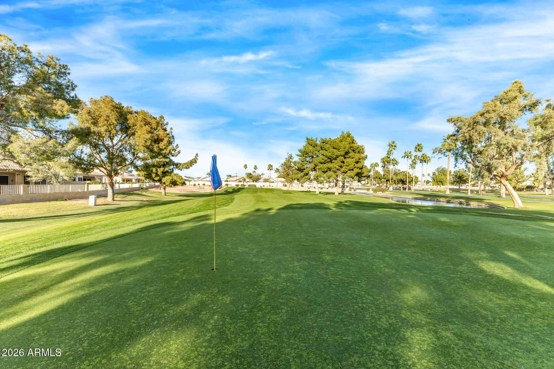 14300 West Bell Road, Unit 153 Surprise, AZ 85374 - Photo 18 of 19 a view of a golf course with a lake