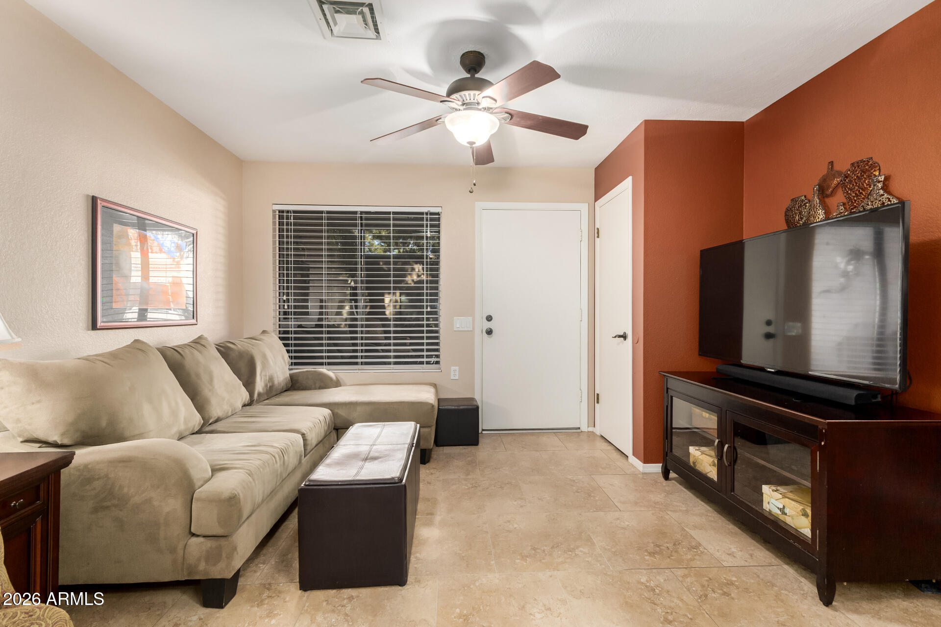 14300 West Bell Road, Unit 153 Surprise, AZ 85374 - Photo 5 of 19 a living room with furniture and a flat screen tv