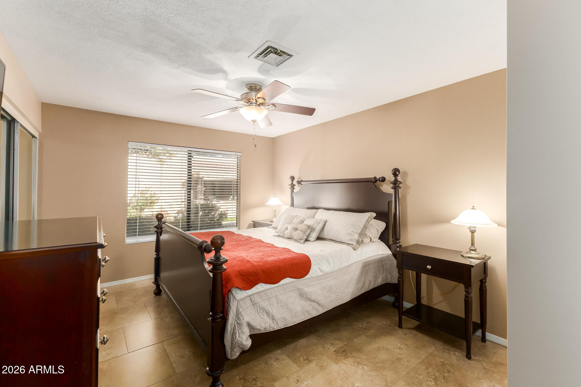 14300 West Bell Road, Unit 153 Surprise, AZ 85374 - Photo 10 of 19 a bedroom with a bed and window