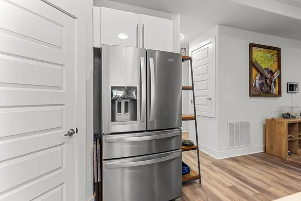 a kitchen with stainless steel appliances granite countertop a stove and cabinets