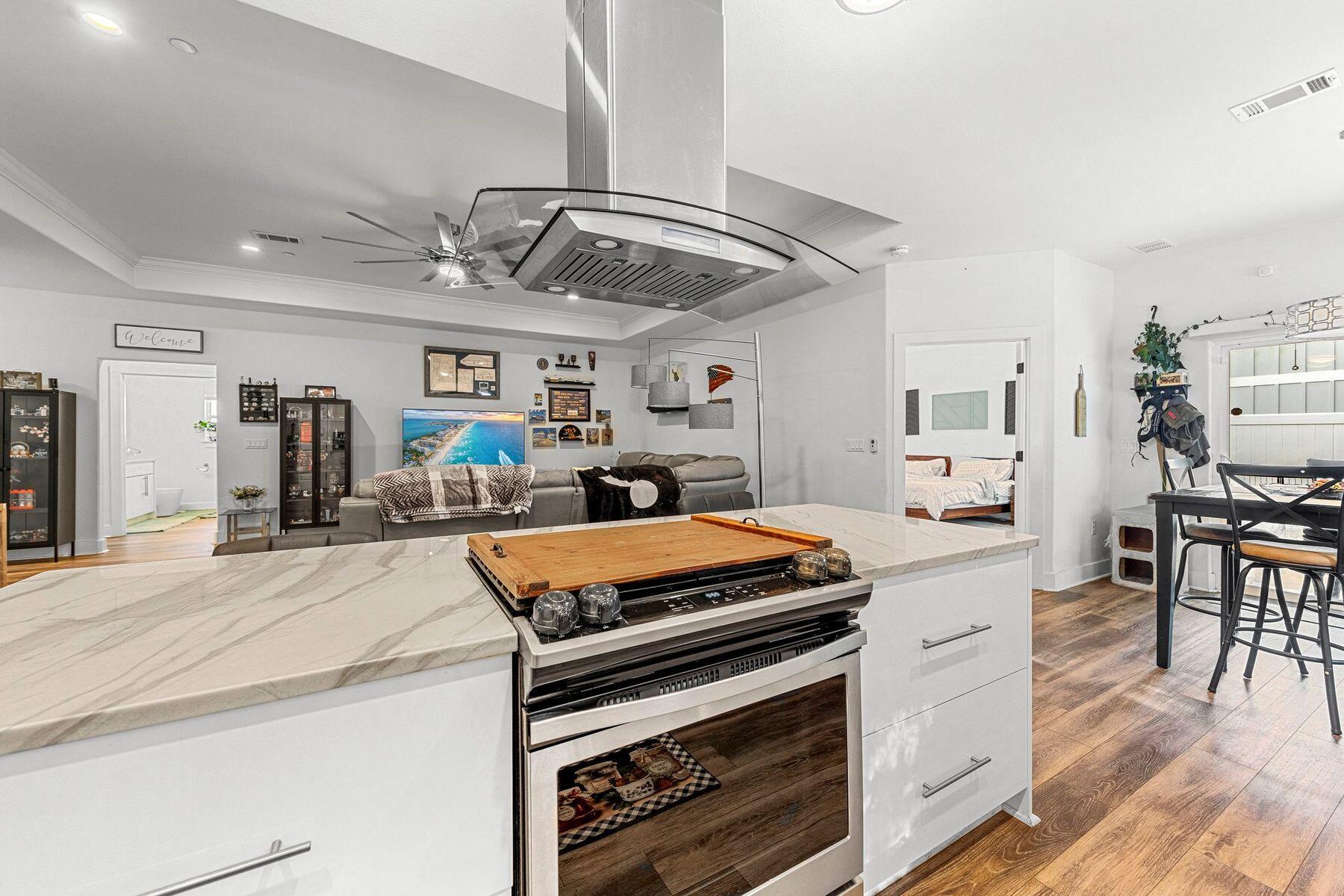 736 Comanche Drive Fort Walton Beach, FL 32547 - Photo 18 of 49 a kitchen with stainless steel appliances granite countertop a stove and cabinets