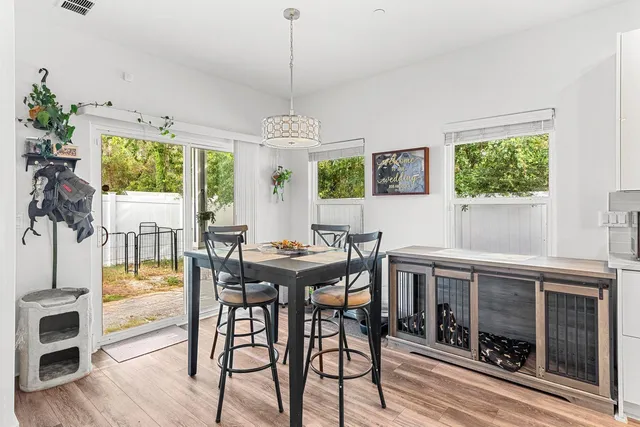 a view of a dining room with furniture window and outside view