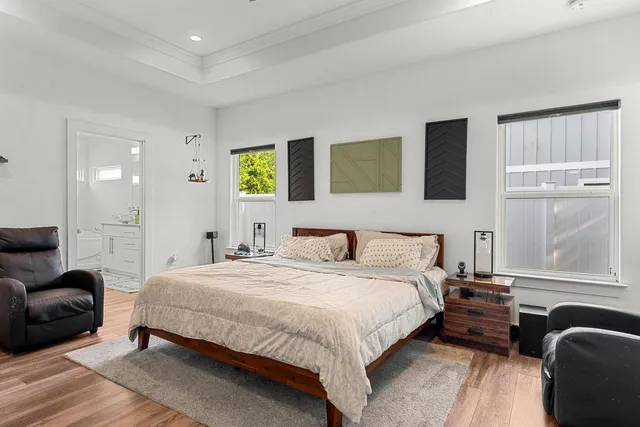 a bedroom with a bed and a couch