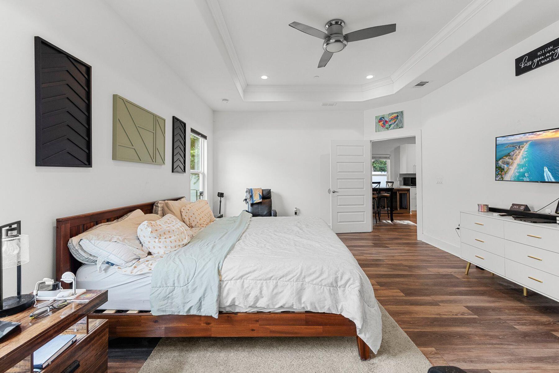 736 Comanche Drive Fort Walton Beach, FL 32547 - Photo 27 of 49 a bedroom with a bed and a chandelier