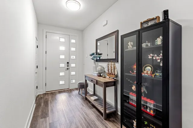 a view of a hallway to a livingroom and furniture