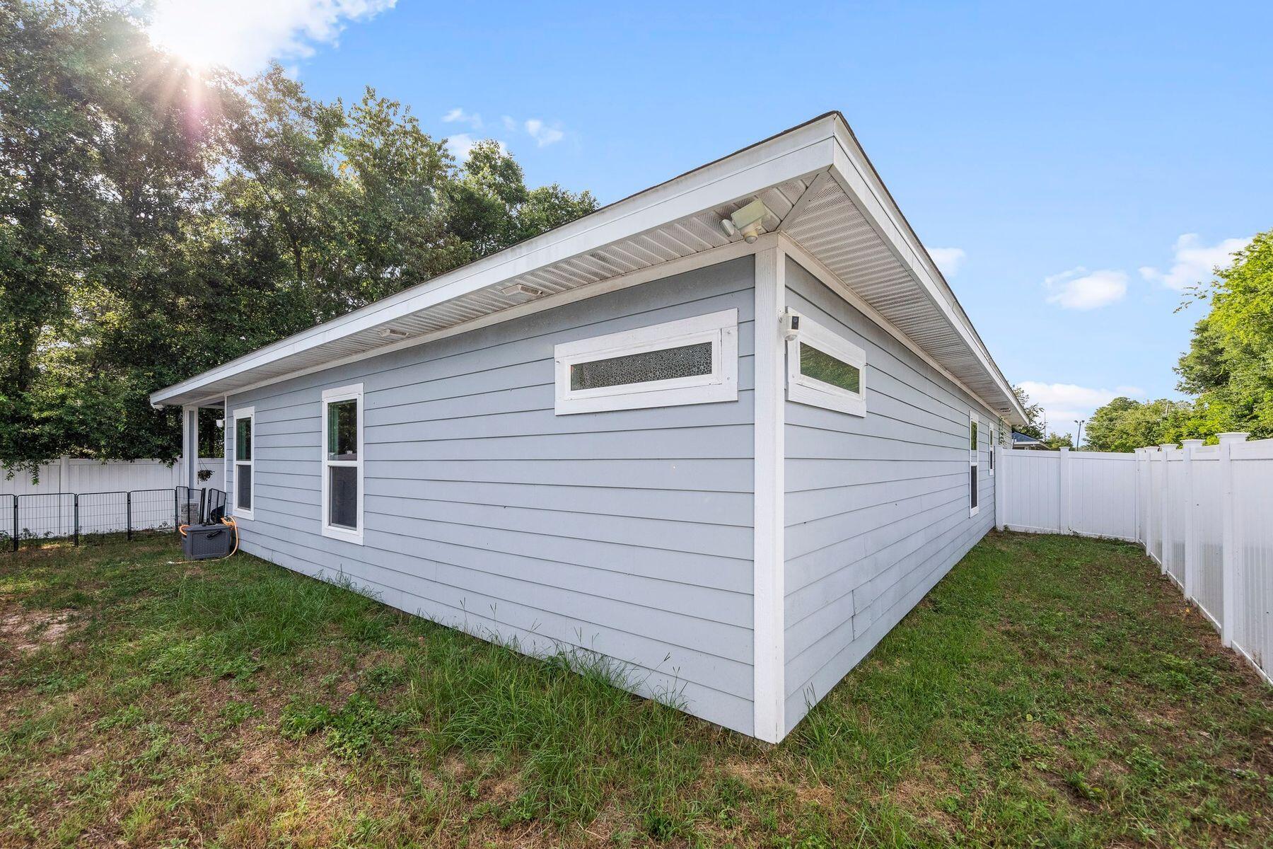 736 Comanche Drive Fort Walton Beach, FL 32547 - Photo 35 of 49 a view of a backyard with a garden