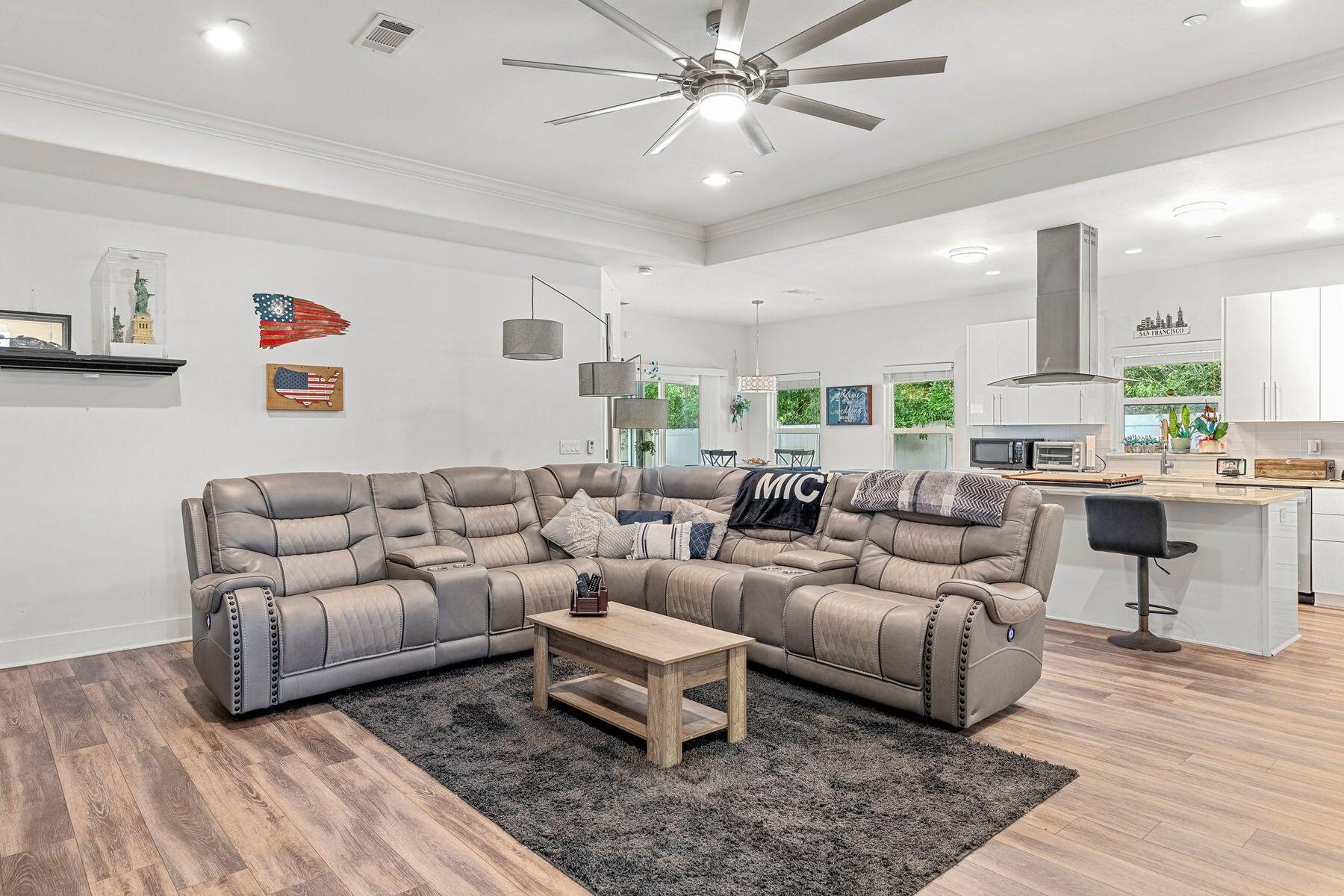 736 Comanche Drive Fort Walton Beach, FL 32547 - Photo 47 of 49 a living room with furniture and a chandelier