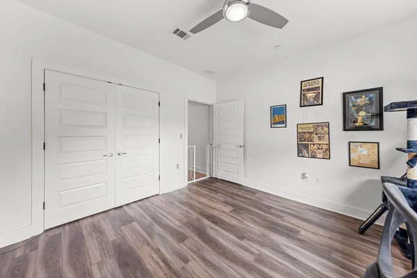 a view of livingroom with hardwood floor and ceiling fan