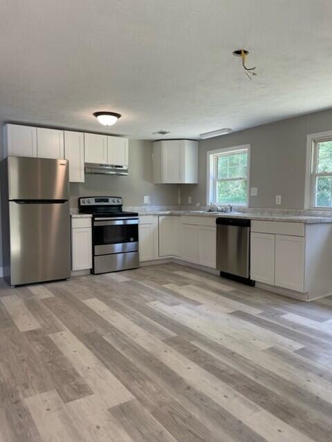 218 Thompson Road Augusta, GA 30906 - Photo 4 of 19 All new flooring, cabinets, paint and appliances in this updated eat in kitchen.