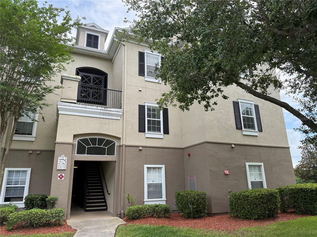 3725 Conroy Road, Unit 2127 Orlando, FL 32839 - Photo 4 of 30 a front view of a house with a yard