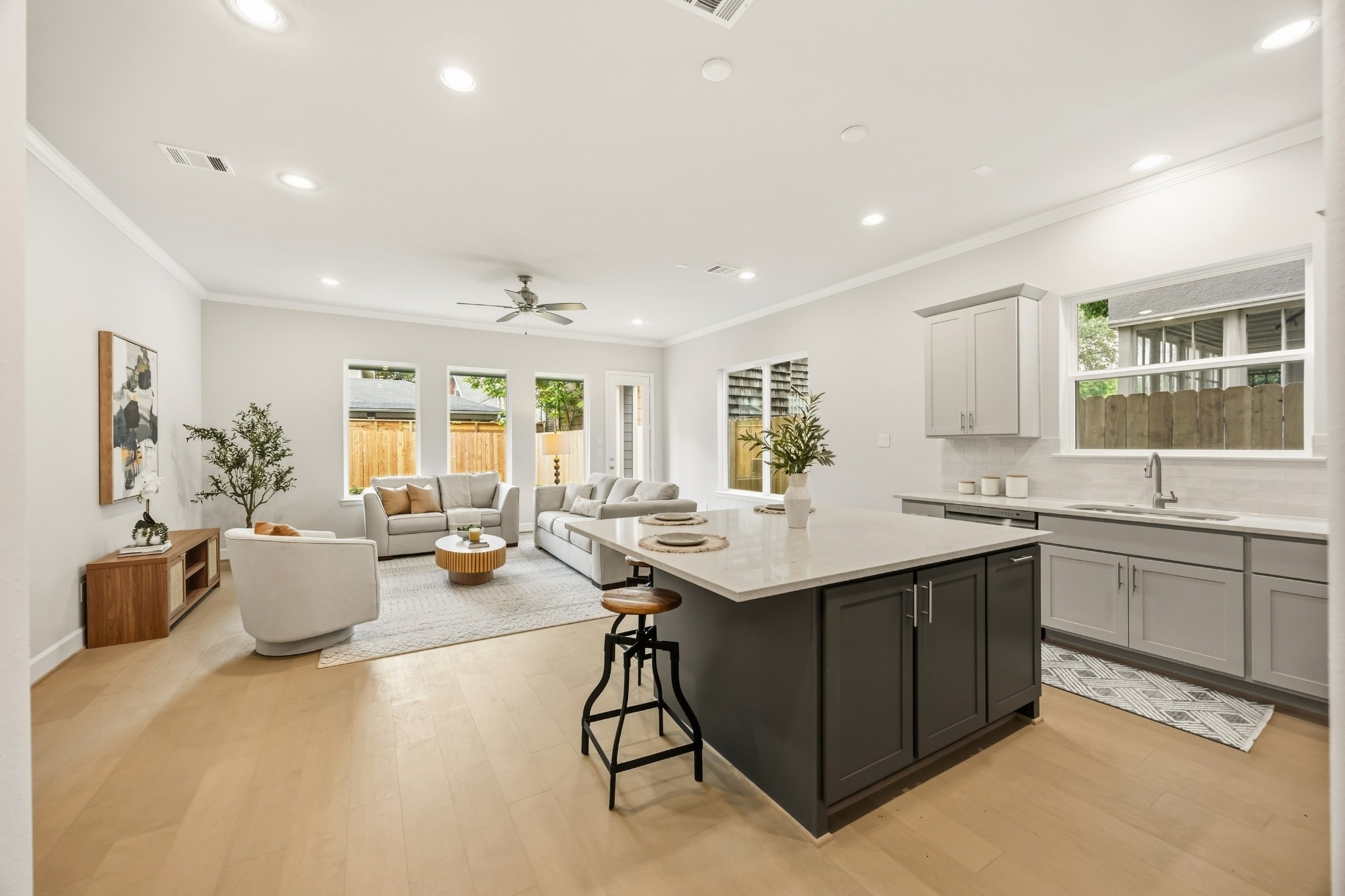 4317 Roseland Street, Unit B Houston, TX 77006 - Photo 3 of 29 This huge island offers adjustable shelves, perfect for storing cookbooks or frequently accessed items, while providing a stunning view of the entire open-concept first-floor living space.