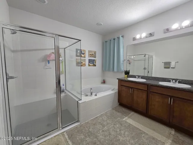 a bed room with a bed and a chandelier