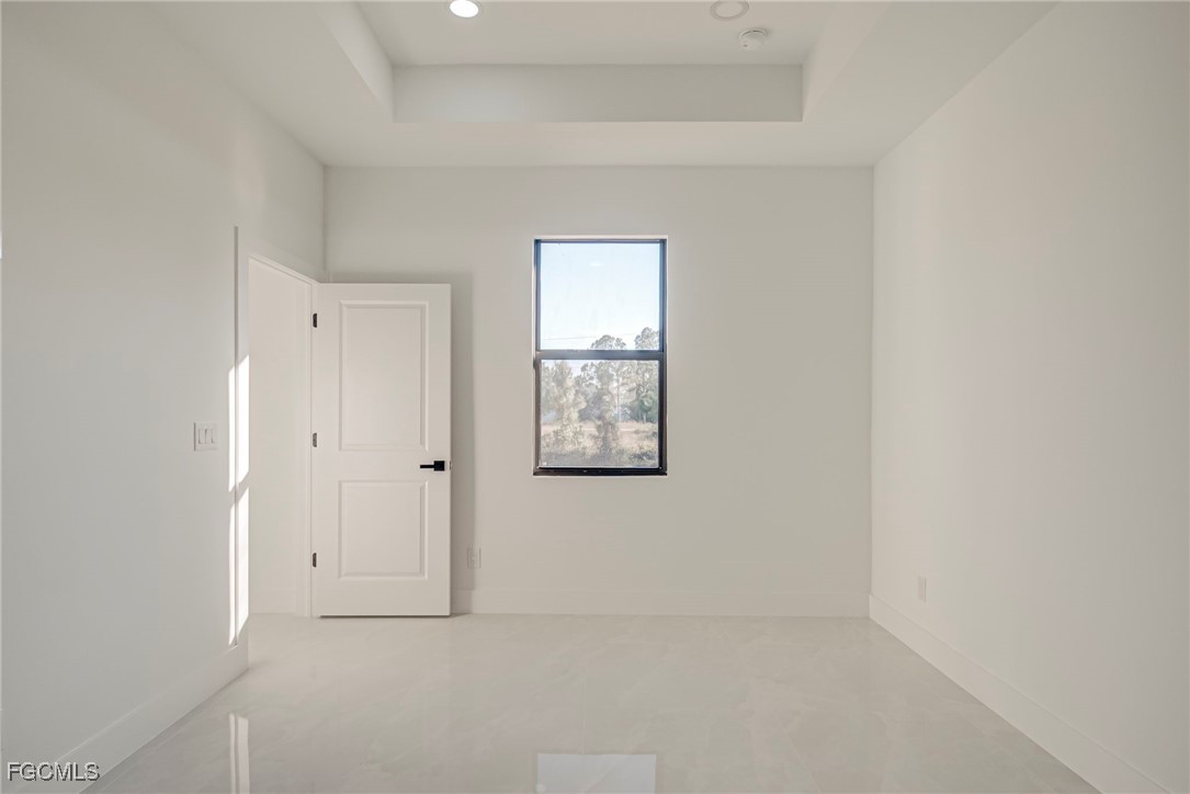 3601 28th Street Southwest Lehigh Acres, FL 33976 - Photo 15 of 35 a view of an empty room with a window