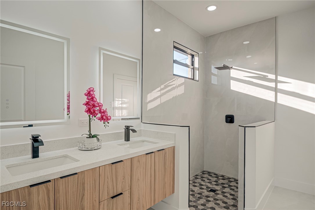 3601 28th Street Southwest Lehigh Acres, FL 33976 - Photo 17 of 35 a bathroom with a sink and a mirror
