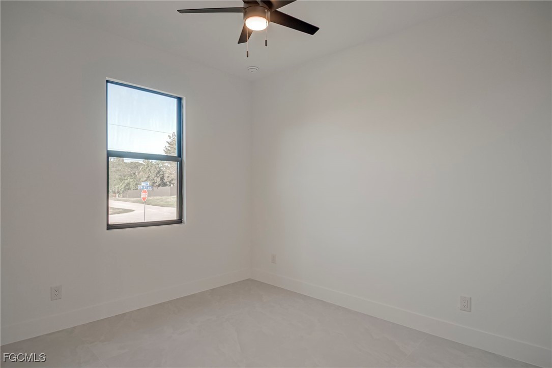 3601 28th Street Southwest Lehigh Acres, FL 33976 - Photo 18 of 35 an empty room with a window