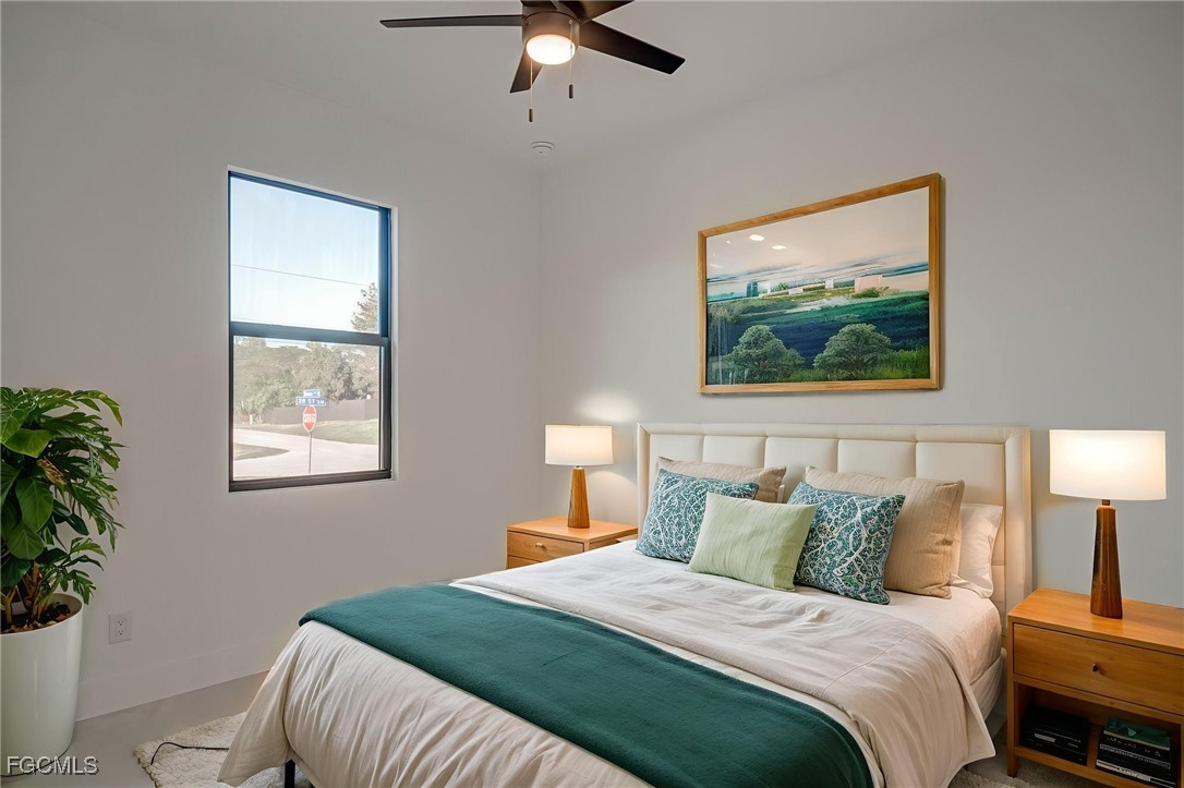 3601 28th Street Southwest Lehigh Acres, FL 33976 - Photo 3 of 35 a bedroom with a bed and a painting on the wall
