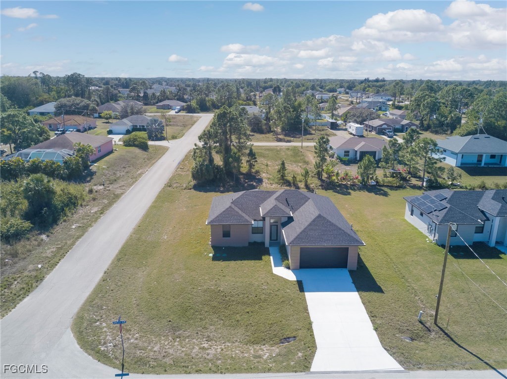 3601 28th Street Southwest Lehigh Acres, FL 33976 - Photo 32 of 35 a view of a house with a yard