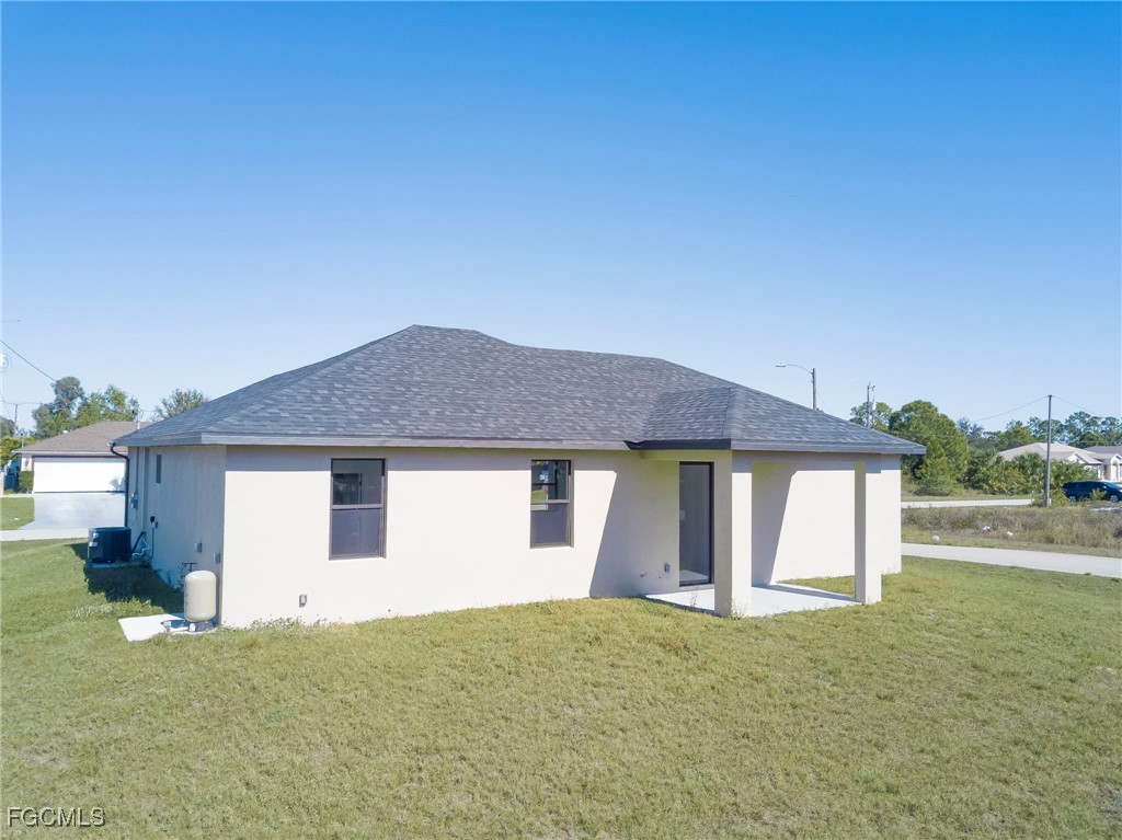 3601 28th Street Southwest Lehigh Acres, FL 33976 - Photo 35 of 35 a house with a outdoor space