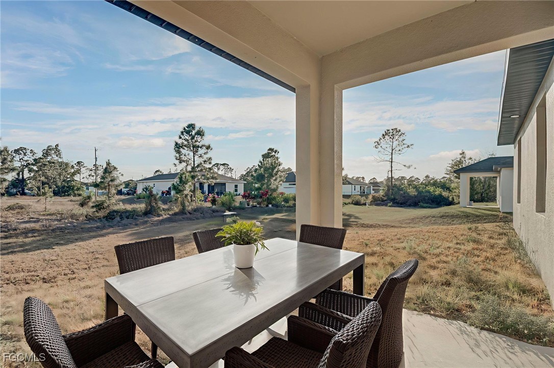 3601 28th Street Southwest Lehigh Acres, FL 33976 - Photo 6 of 35 a view of an outdoor dining space with furniture