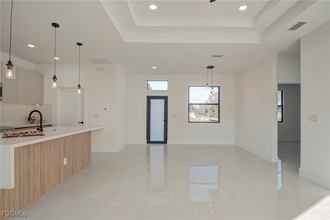 3601 28th Street Southwest Lehigh Acres, FL 33976 - Photo 9 of 35 a large bathroom with a double vanity sink a mirror and a shower