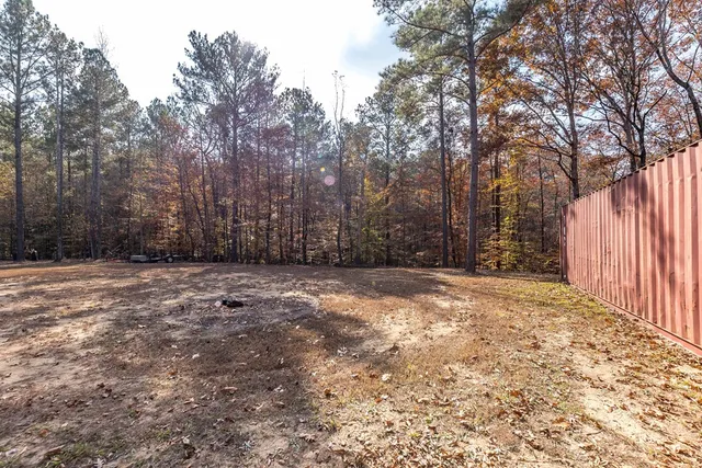 a view of a yard with trees
