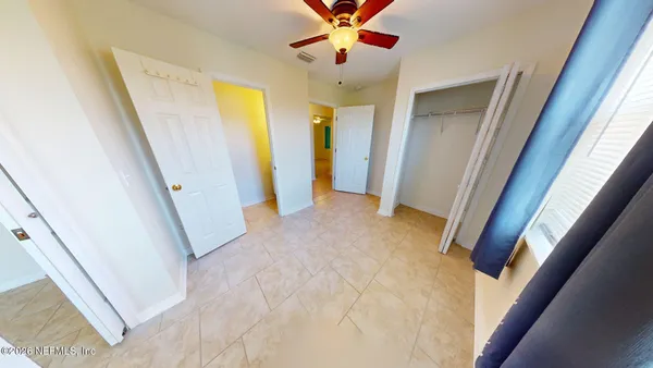 a view of a hallway with front door