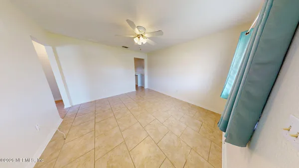 a view of a big room with closet and chandelier fan