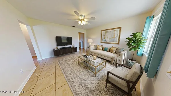 a living room with furniture and a flat screen tv