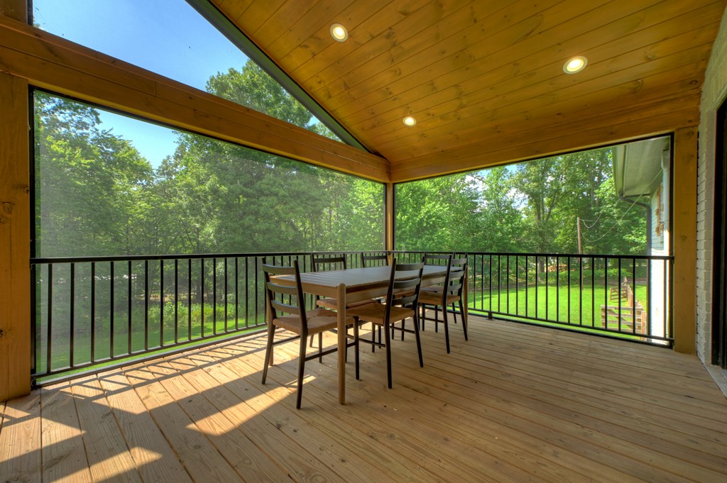 975 Goss Road Epworth, GA 30541 - Photo 41 of 58 a view of a chairs and table in patio with wooden floor