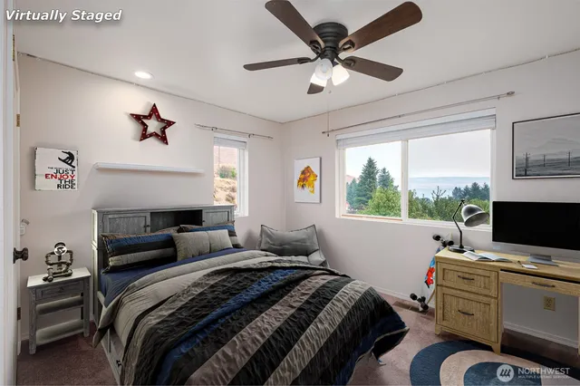 a bathroom with a double vanity sink toilet mirror and shower