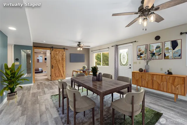a view of a dining room with furniture and a livingroom