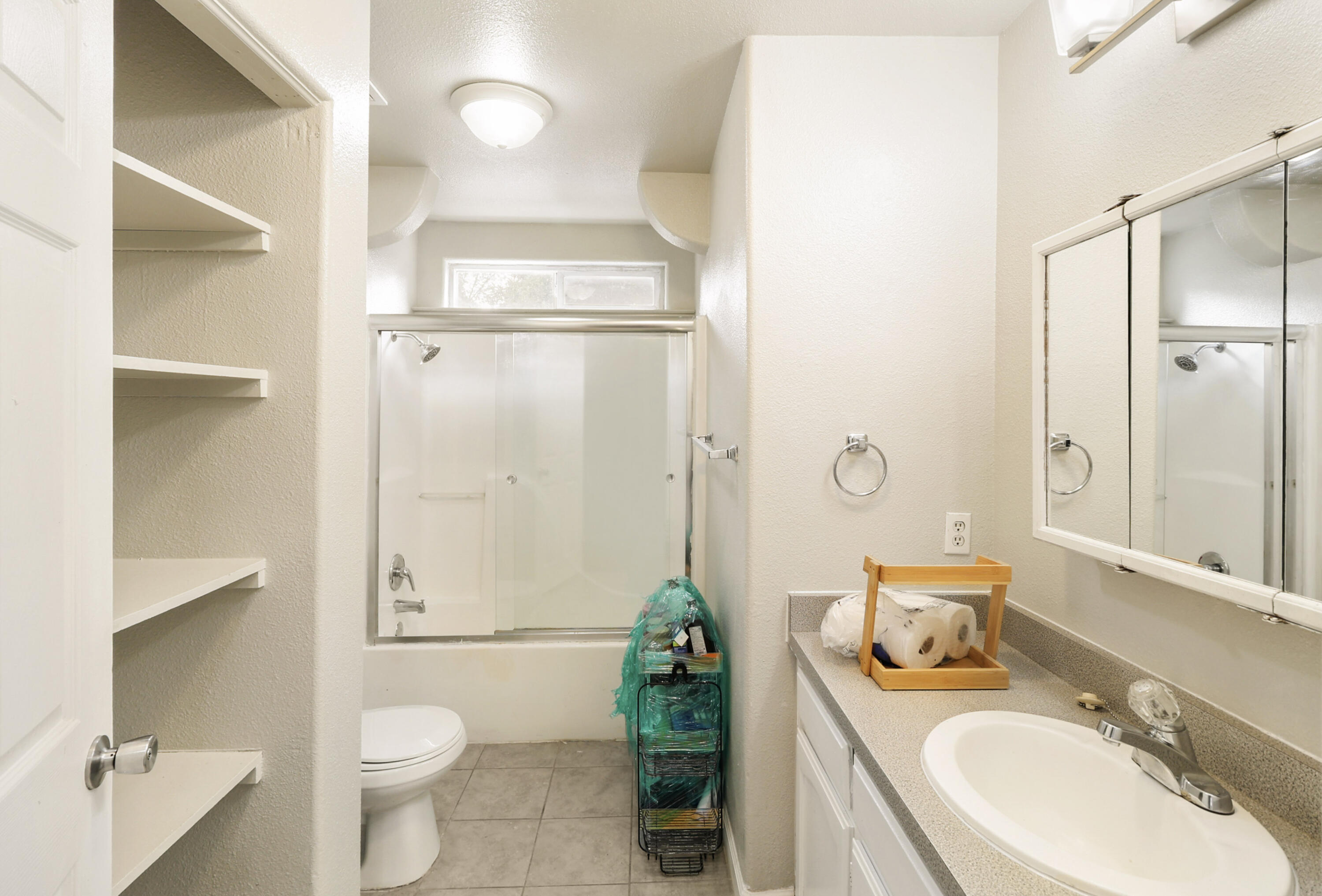1152-1154 Echo Road Redding, CA 96002 - Photo 17 of 32 a bathroom with a granite countertop sink a toilet and shower