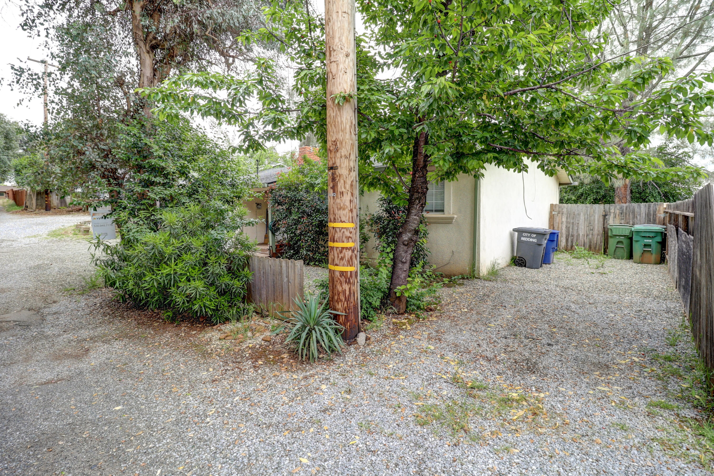 1152-1154 Echo Road Redding, CA 96002 - Photo 32 of 32 a view of a backyard with large trees and plants