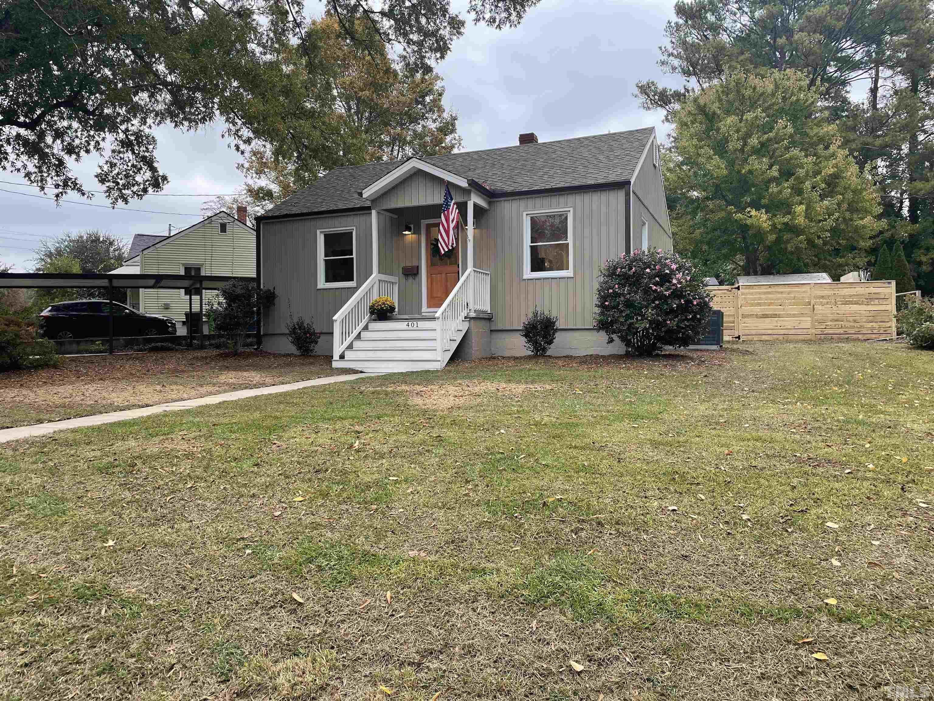 a view of a house with backyard porch and sitting area
