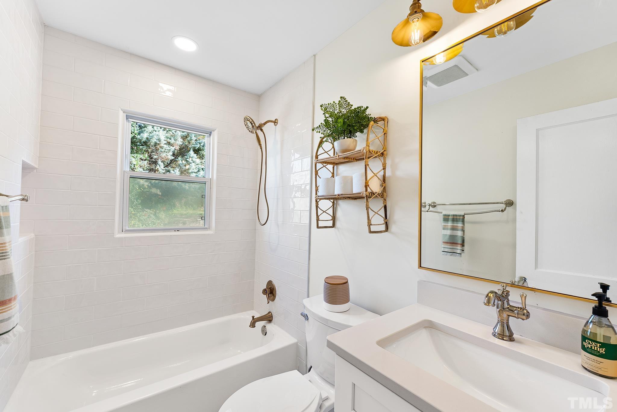 401 Plainview Avenue Raleigh, NC 27604 - Photo 18 of 28 a bathroom with a sink and a mirror