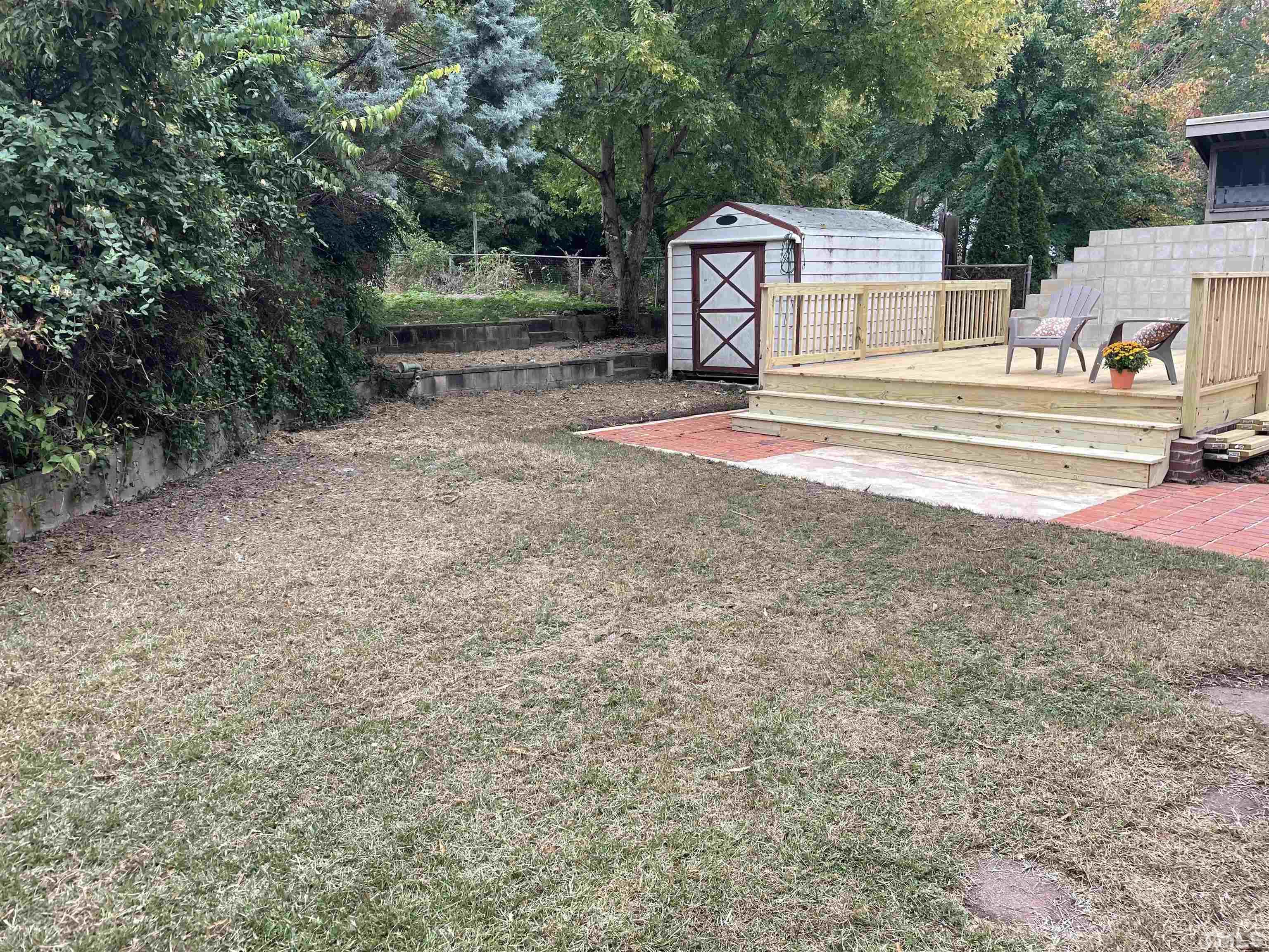 401 Plainview Avenue Raleigh, NC 27604 - Photo 24 of 28 a view of a house with a yard and large tree