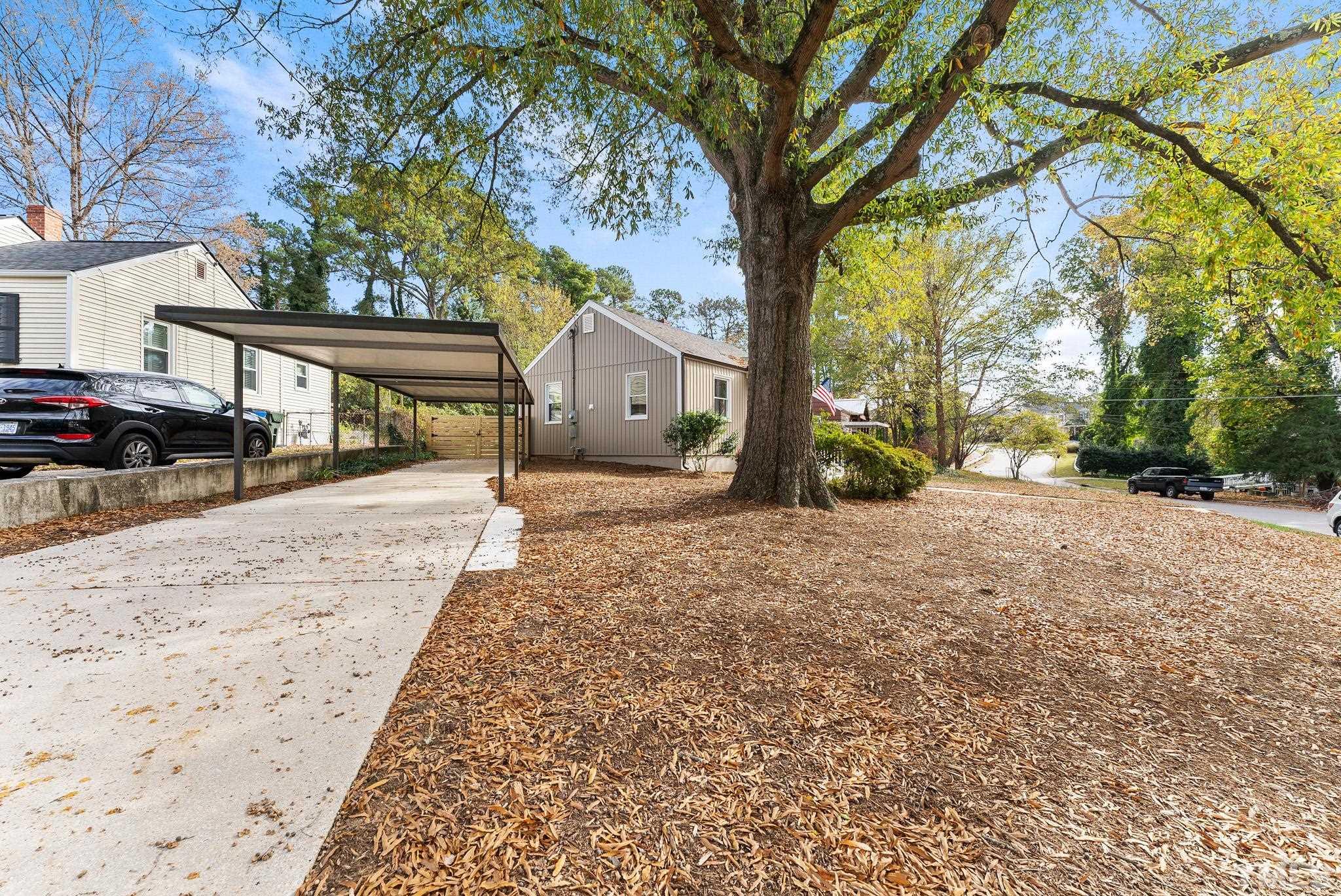 401 Plainview Avenue Raleigh, NC 27604 - Photo 4 of 28 a view of a road with a snow on the side of the road